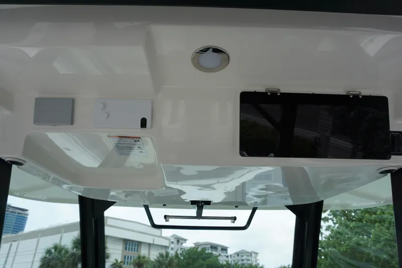 Bwcp0430a424 Yacht Photos Pics 2024 Boston Whaler 380 Outrage helm ceiling with storage compartments and lighting.