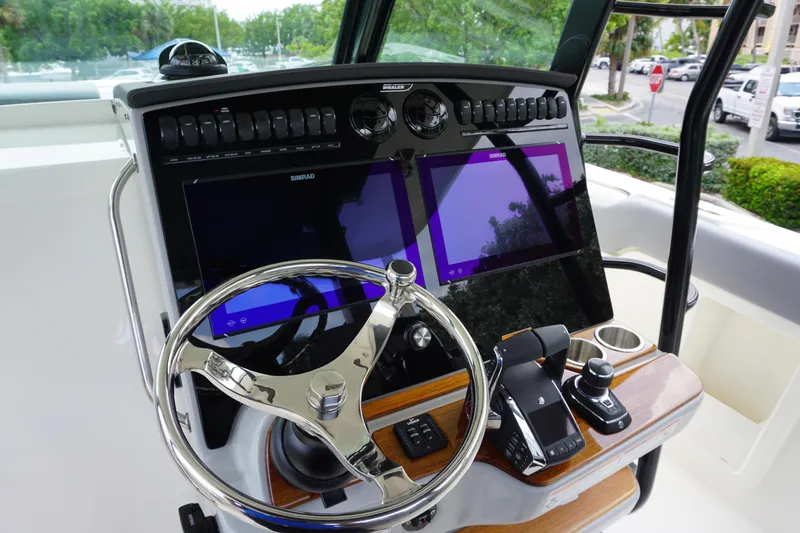 Bwcp0430a424 Yacht Photos Pics 2024 Boston Whaler 380 Outrage helm with dual screens and advanced controls.