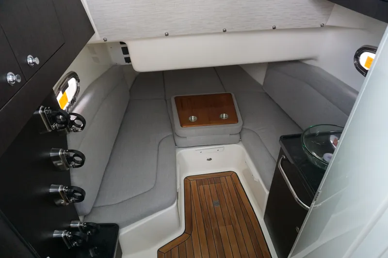 Bwcp0430a424 Yacht Photos Pics 2024 Boston Whaler 380 Outrage cabin interior with grey seating and wooden flooring.