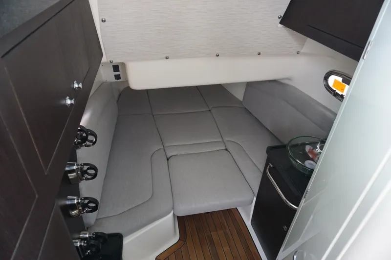 Bwcp0430a424 Yacht Photos Pics 2024 Boston Whaler 380 Outrage cabin interior with grey seating and wooden flooring.