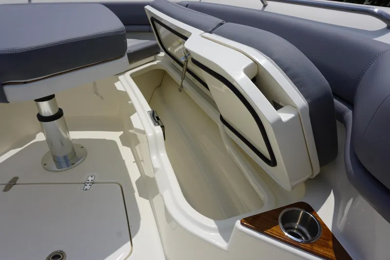 Bwcp0430a424 Yacht Photos Pics 2024 Boston Whaler 380 Outrage interior storage compartment with cushioned seating.