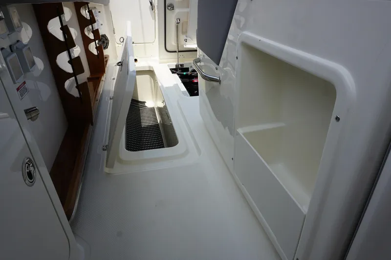 Bwcp0430a424 Yacht Photos Pics 2024 Boston Whaler 380 Outrage interior with storage compartments and sleek design.