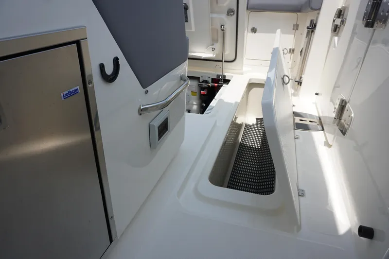 Bwcp0430a424 Yacht Photos Pics 2024 Boston Whaler 380 Outrage interior with storage compartment and stainless steel features.