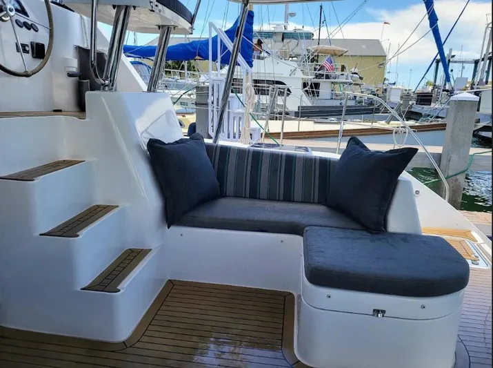  Yacht Photos Pics Leopard 44 yacht interior with cushioned seating, docked at marina, 2016 model.