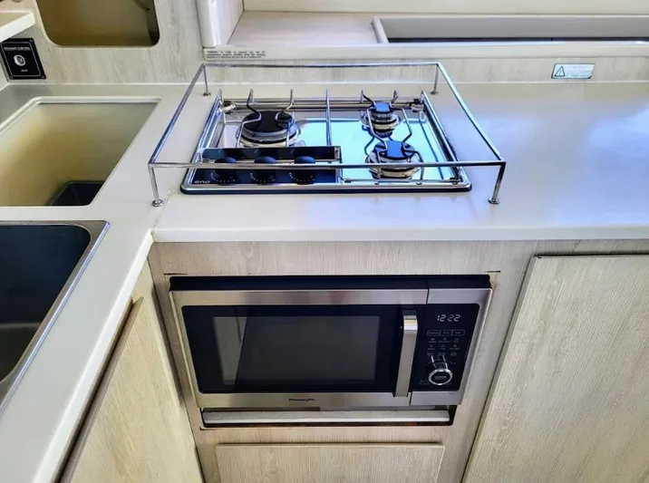 Ohana Yacht Photos Pics Leopard 44, 2016 kitchen with stove and microwave.