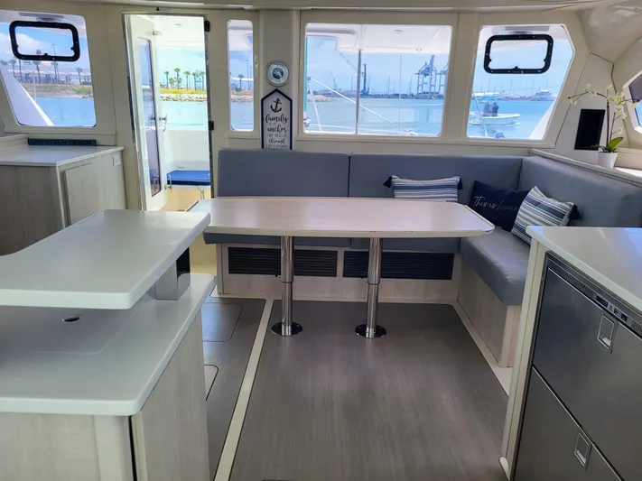 Ohana Yacht Photos Pics Interior of a 2016 Leopard 44 yacht with modern dining area.