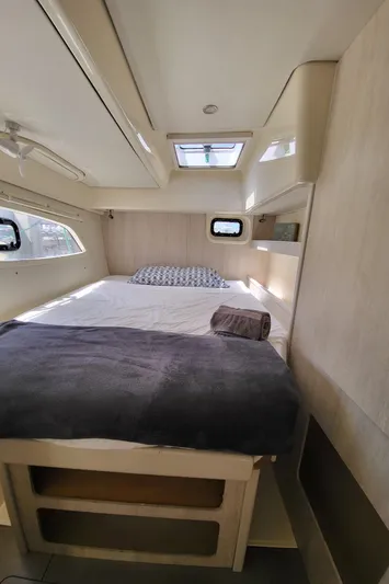 Ohana Yacht Photos Pics Interior of a Leopard 44 yacht, bedroom with bed and windows.