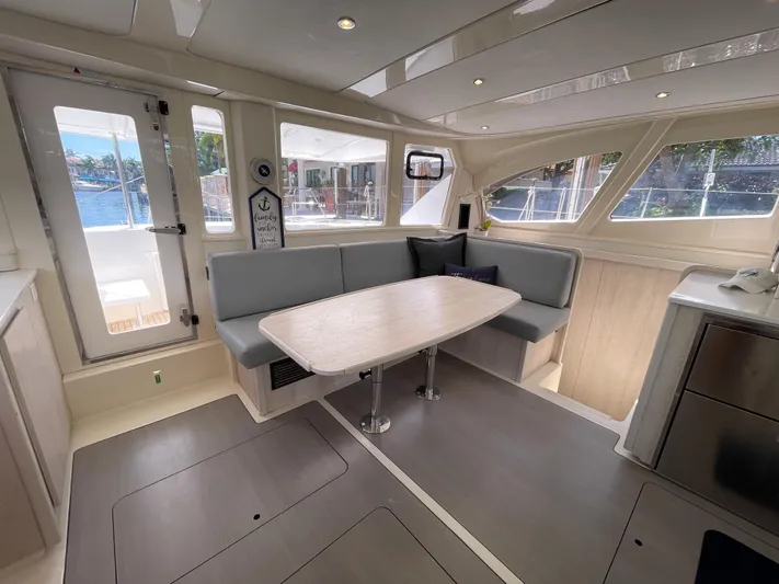 Ohana Yacht Photos Pics Interior of a 2016 Leopard 44 yacht with modern dining area.