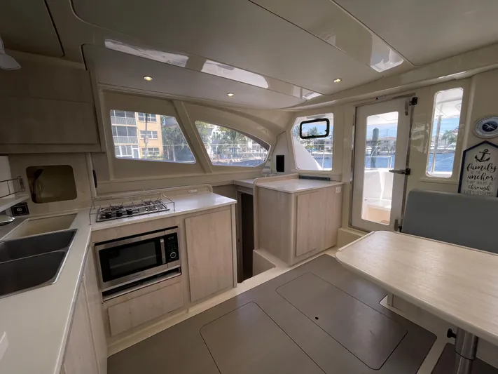 Ohana Yacht Photos Pics Interior of a 2016 Leopard 44 yacht featuring a modern kitchen.