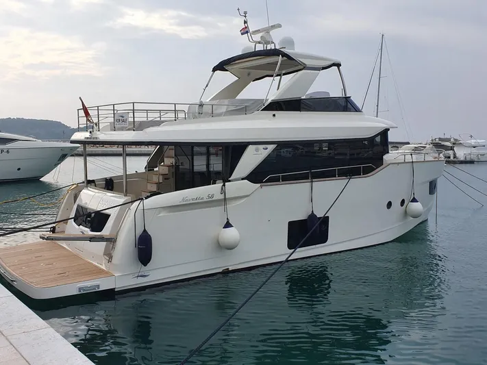  Yacht Photos Pics Luxury Absolute 58 yacht docked at marina, 2016 model, sleek design, calm waters.