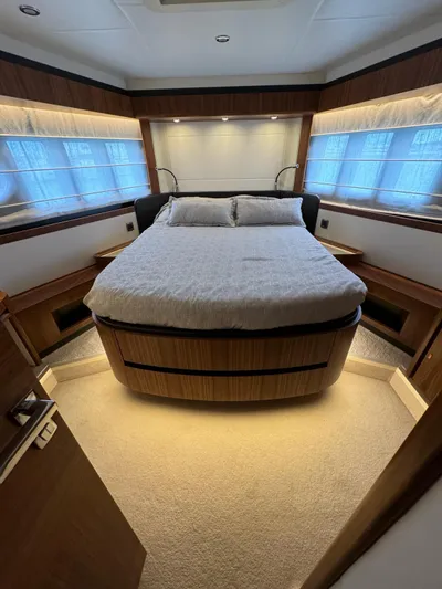  Yacht Photos Pics Luxurious bedroom interior of 2016 Absolute 58 yacht with elegant lighting and modern design.