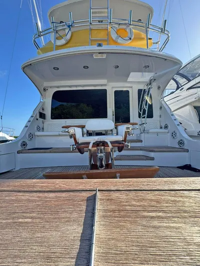  Yacht Photos Pics 2007 Hatteras 68 Convertible yacht, rear view with fishing chair and deck.