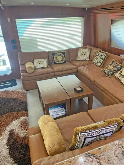  Yacht Photos Pics Luxurious interior of 2007 Hatteras 68 Convertible yacht with plush seating and elegant decor.