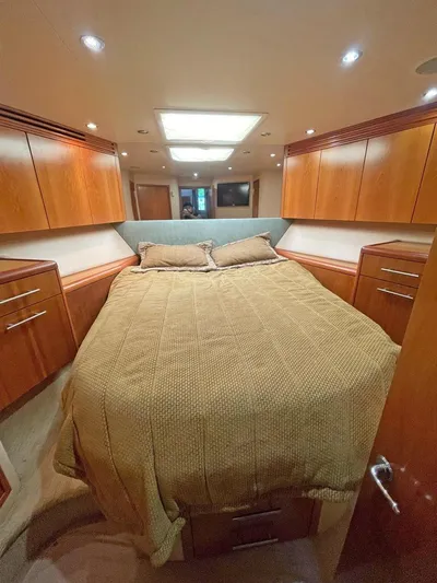  Yacht Photos Pics Luxurious cabin interior of 2007 Hatteras 68 Convertible yacht with cozy bedding.