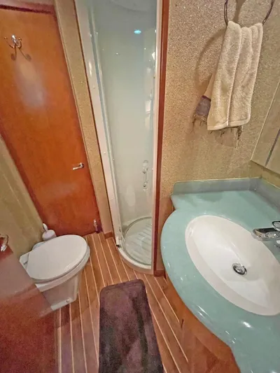  Yacht Photos Pics Bathroom interior of 2007 Hatteras 68 Convertible yacht with shower and sink.