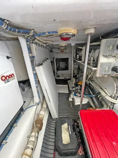  Yacht Photos Pics Engine room of 2007 Hatteras 68 Convertible yacht with Onan generator and various equipment.