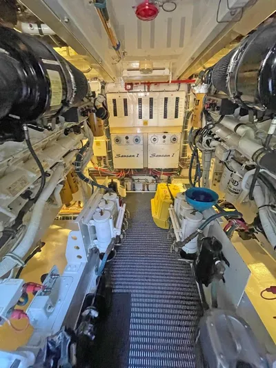  Yacht Photos Pics Engine room of 2007 Hatteras 68 Convertible yacht, showcasing machinery and equipment.