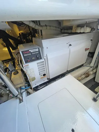  Yacht Photos Pics Engine room of 2007 Hatteras 68 Convertible with Onan marine generator.