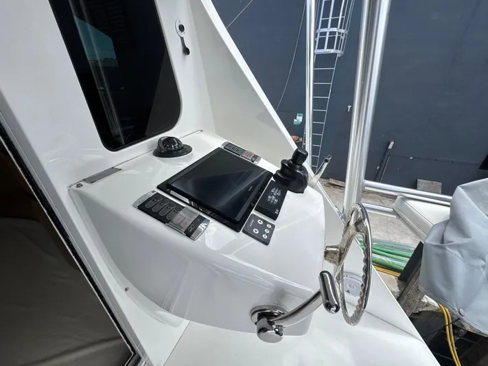 Dry Bones Yacht Photos Pics Control panel of a 2017 Viking 66 Enclosed Bridge yacht, featuring modern navigation equipment.