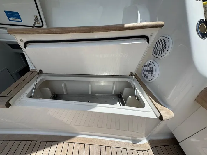 Dry Bones Yacht Photos Pics Open storage compartment on 2017 Viking 66 Enclosed Bridge yacht deck.