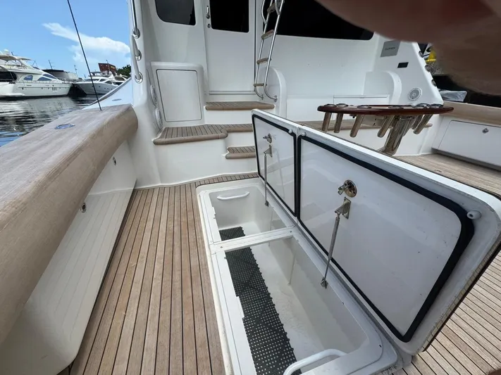 Dry Bones Yacht Photos Pics 2017 Viking 66 Enclosed Bridge yacht deck with open storage compartments.