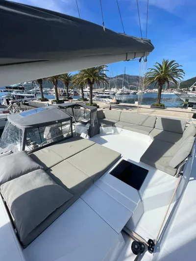  Yacht Photos Pics 2021 Fountaine Pajot Catamaran Elba 45 with spacious deck and marina view.