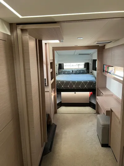  Yacht Photos Pics Luxurious interior of 2021 Fountaine Pajot Catamaran Elba 45 with modern bedroom and elegant design.