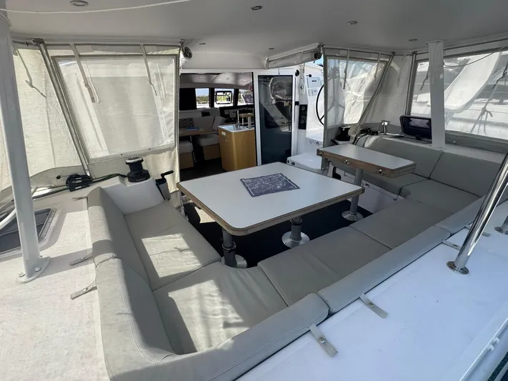 Traverse Yacht Photos Pics Spacious interior of 2021 Outremer 51 catamaran with seating and tables.