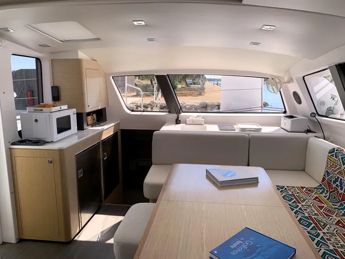 Traverse Yacht Photos Pics Interior of 2021 Outremer 51 yacht, featuring modern kitchen and cozy seating area.