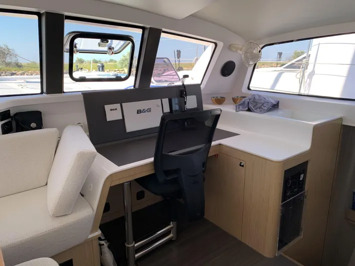 Traverse Yacht Photos Pics Interior of 2021 Outremer 51 yacht with navigation station and modern seating.