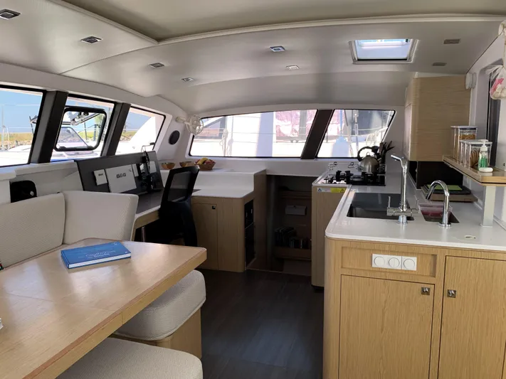 Traverse Yacht Photos Pics Interior of 2021 Outremer 51 catamaran featuring modern kitchen and dining area.