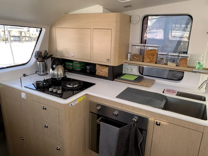 Traverse Yacht Photos Pics Modern kitchen in 2021 Outremer 51 yacht with stove, oven, and storage.