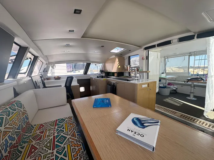 Traverse Yacht Photos Pics Interior of 2021 Outremer 51 catamaran, featuring modern kitchen and seating area.