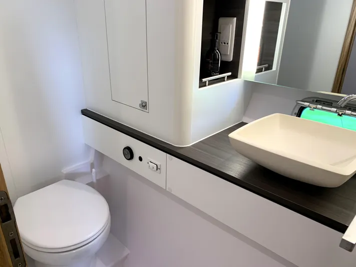 Traverse Yacht Photos Pics Modern bathroom in 2021 Outremer 51 yacht with sleek sink and toilet.