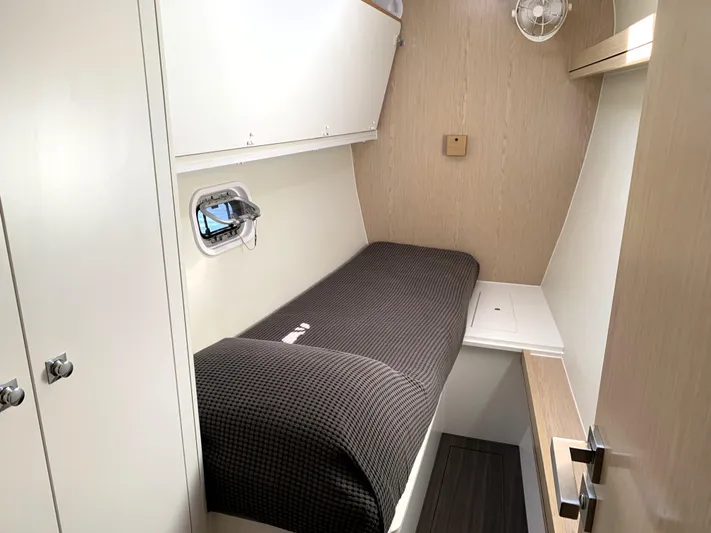 Traverse Yacht Photos Pics 2021 Outremer 51 yacht cabin with single bed and storage.