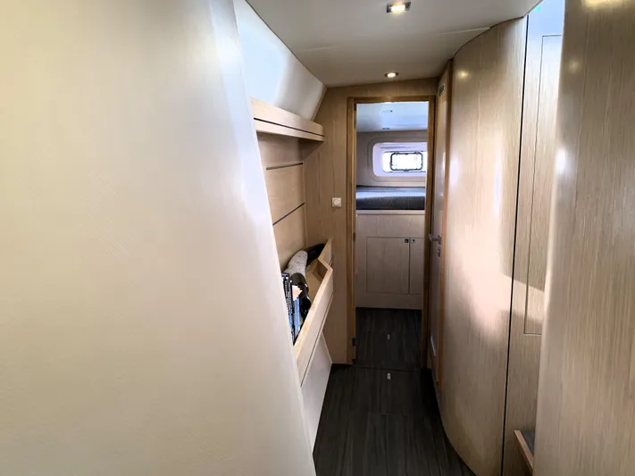 Traverse Yacht Photos Pics Interior of 2021 Outremer 51 yacht, featuring sleek wooden cabinetry and modern design.