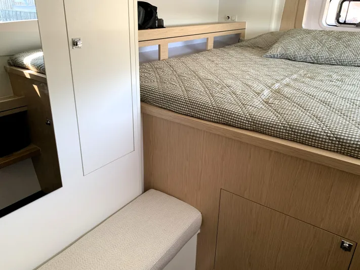 Traverse Yacht Photos Pics Interior of 2021 Outremer 51 yacht cabin with bed and storage.