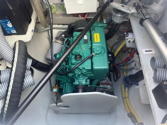 Traverse Yacht Photos Pics Engine compartment of a 2021 Outremer 51 catamaran, showcasing mechanical components and wiring.