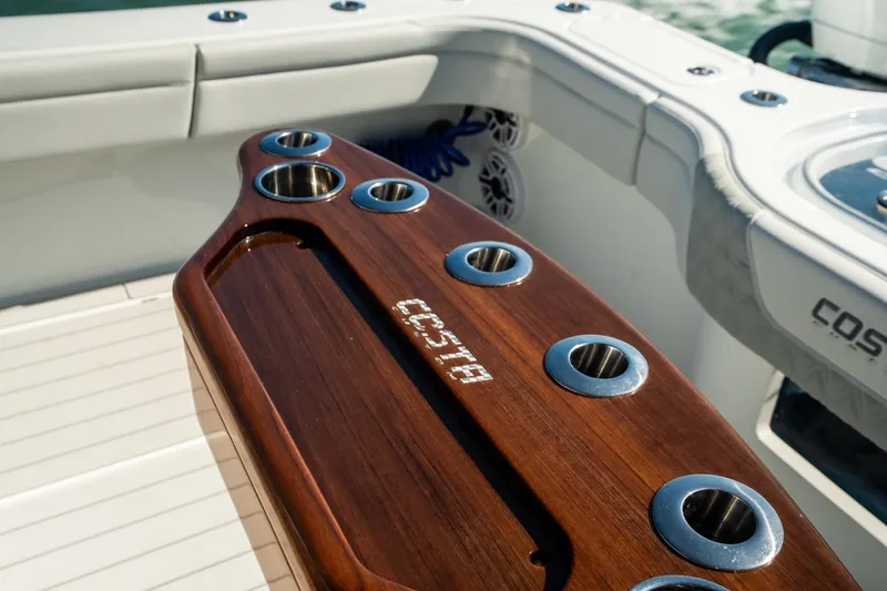  Yacht Photos Pics 2025 Costa Custom Boats 34, featuring a sleek wooden rod holder on deck.