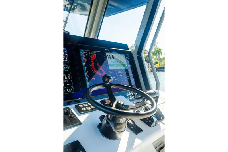  Yacht Photos Pics Cockpit of 2025 Costa Custom Boats 34, featuring advanced navigation displays and steering wheel.