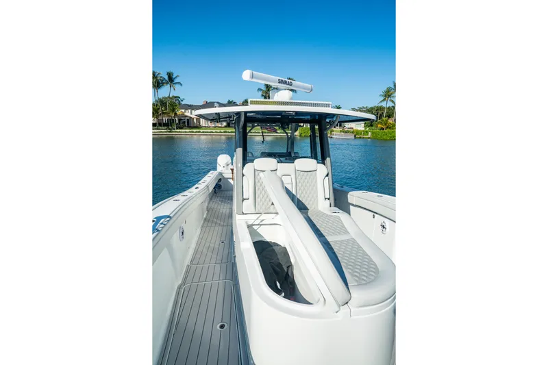  Yacht Photos Pics 2025 Costa Custom Boats 34 model on serene water, showcasing sleek design and luxury features.