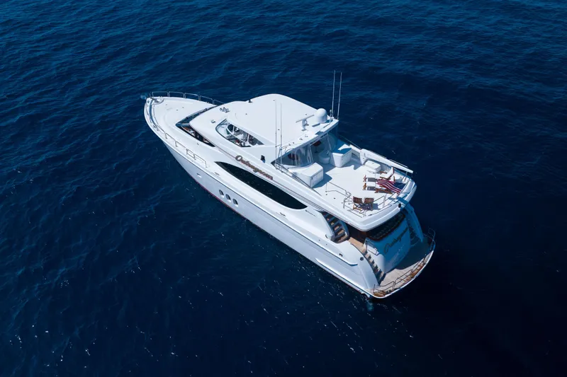 Outrageous Yacht Photos Pics Aerial view of 2005 Hatteras 80 Motor Yacht cruising on open sea.