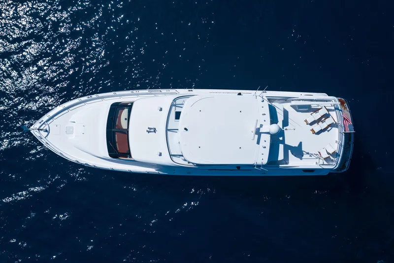 Outrageous Yacht Photos Pics Aerial view of 2005 Hatteras 80 Motor Yacht on open water.