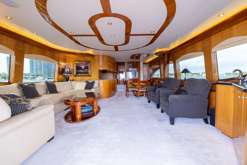 Outrageous Yacht Photos Pics Luxurious interior of 2005 Hatteras 80 Motor Yacht with elegant seating and wood accents.