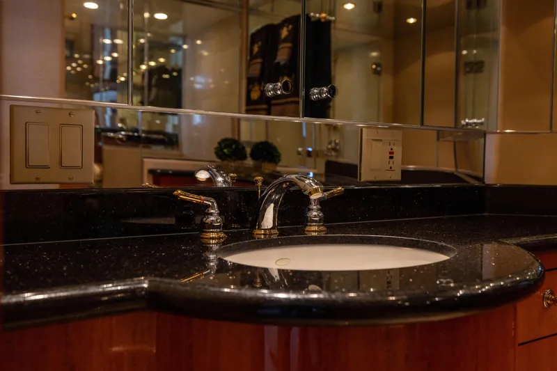 Outrageous Yacht Photos Pics Luxurious bathroom sink in 2005 Hatteras 80 Motor Yacht with elegant fixtures.