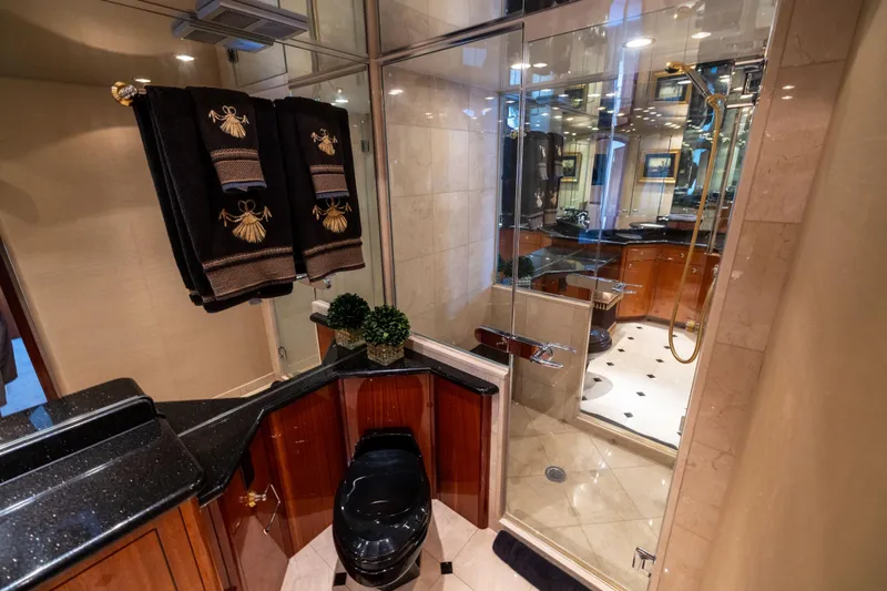 Outrageous Yacht Photos Pics Luxurious bathroom in 2005 Hatteras 80 Motor Yacht with elegant fixtures and decor.