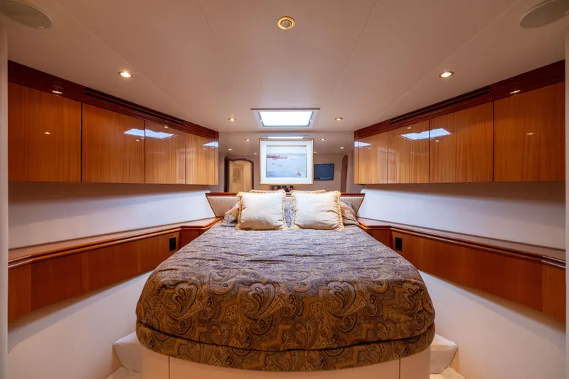Outrageous Yacht Photos Pics Luxurious bedroom interior of 2005 Hatteras 80 Motor Yacht with elegant wood cabinetry.