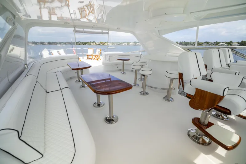 Outrageous Yacht Photos Pics Luxurious 2005 Hatteras 80 Motor Yacht interior with elegant seating and scenic views.