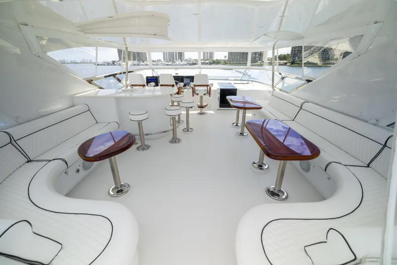 Outrageous Yacht Photos Pics Luxurious 2005 Hatteras 80 Motor Yacht interior with elegant seating and polished tables.