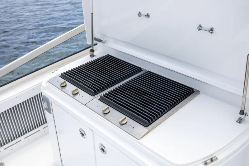 Outrageous Yacht Photos Pics Outdoor grill on 2005 Hatteras 80 Motor Yacht, overlooking the water.